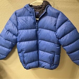 Triple star brand puffer with hood and zippered pockets.